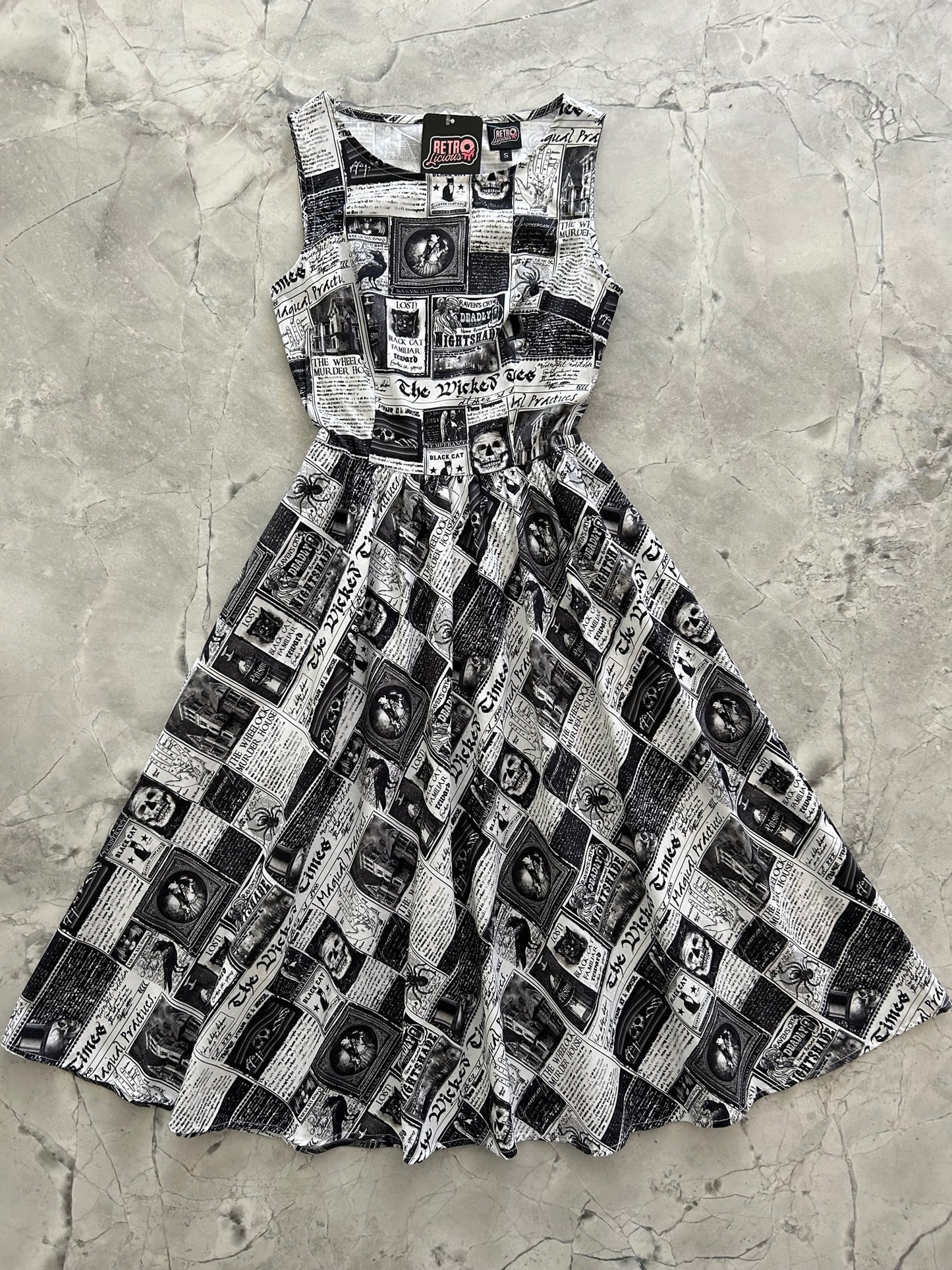 a flat lay of our spooky print midi dress