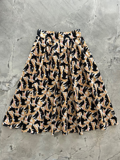 flat lay of vintage style dorid skirt in our birds print