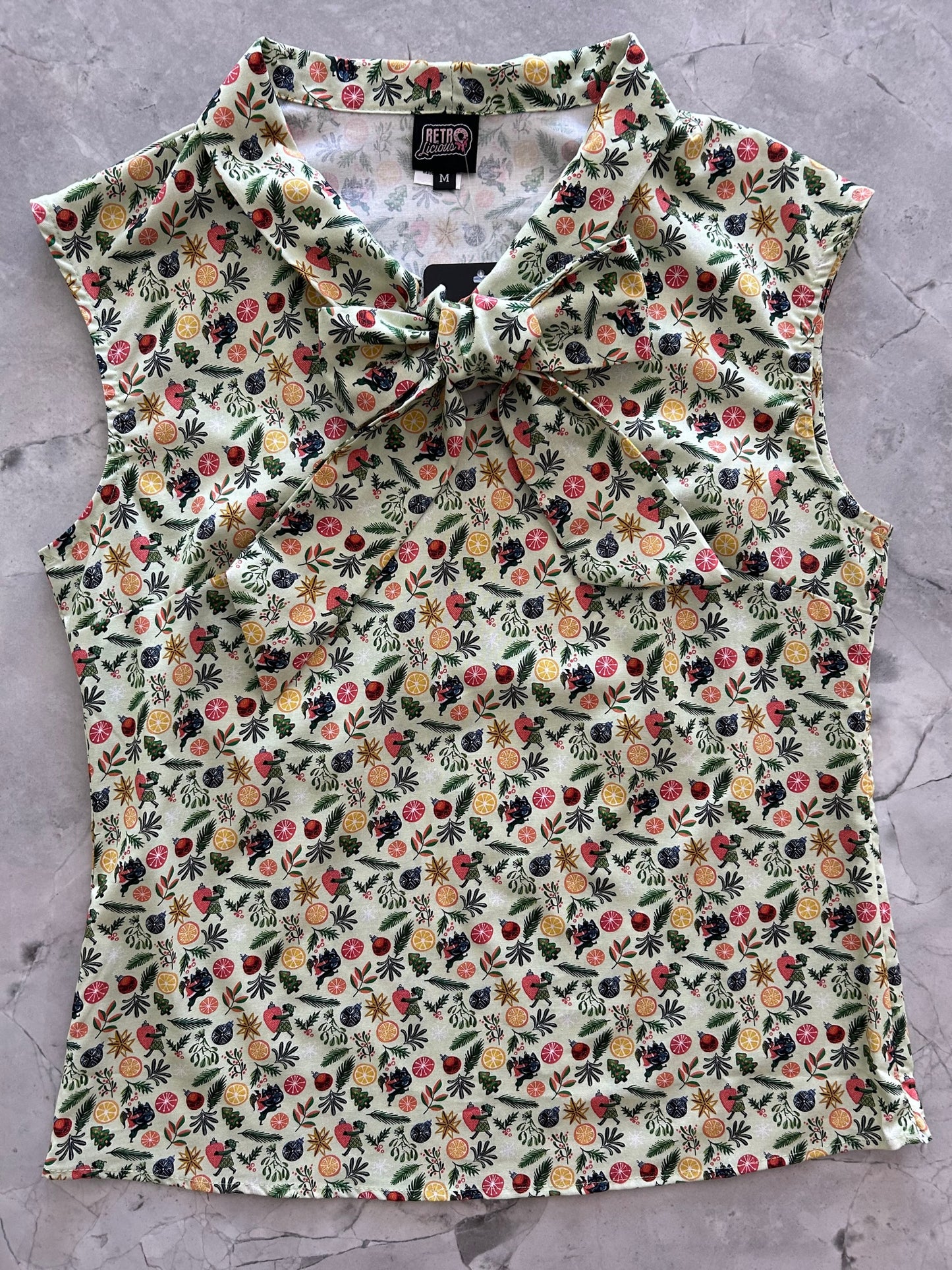 flat lay of the front of elves and ornaments bow top
