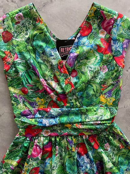 flat lay of garden greta dress showing the surplus neckline 