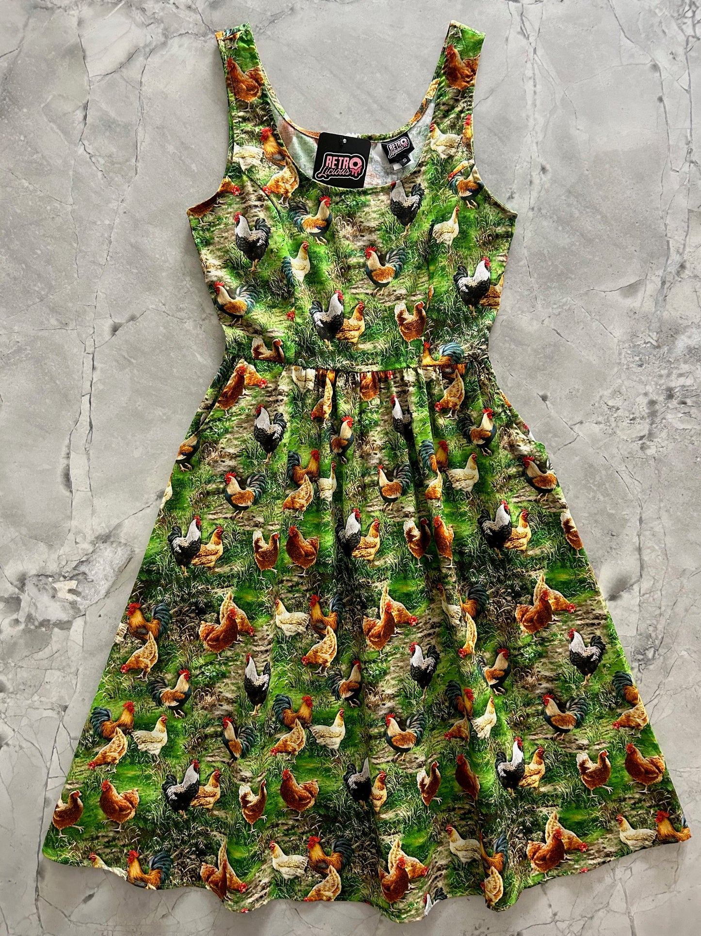 flatlay of spring chicken dress