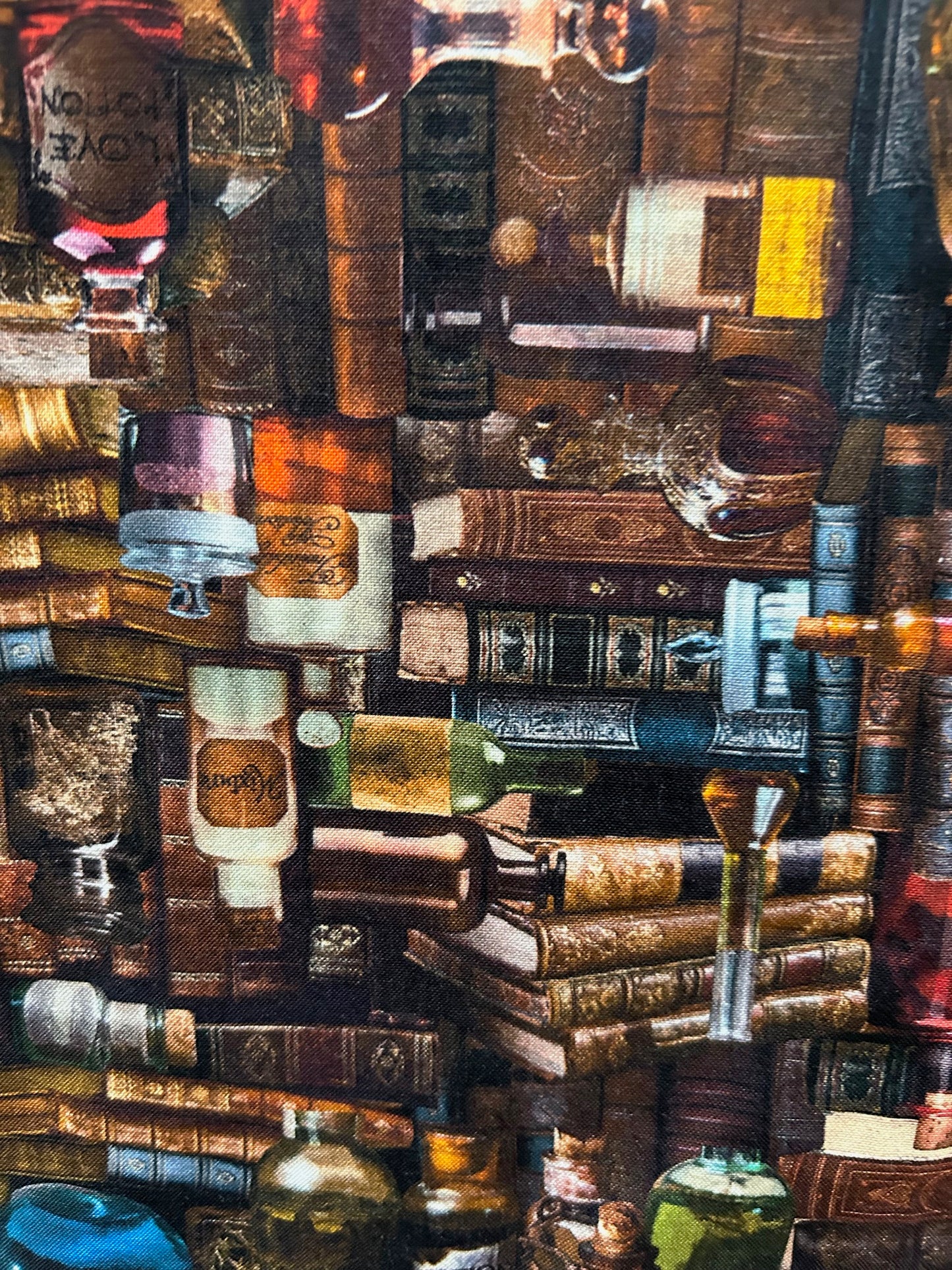 close up of the print showing the stacked books and potion bottles