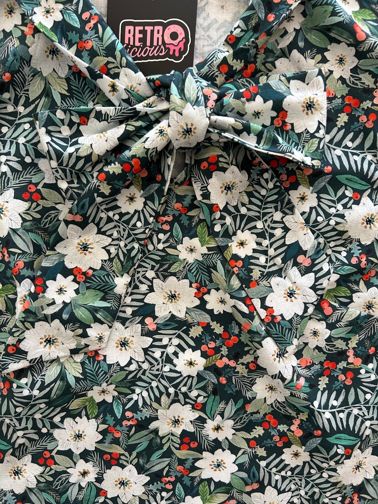 close up of the winter floral bow top