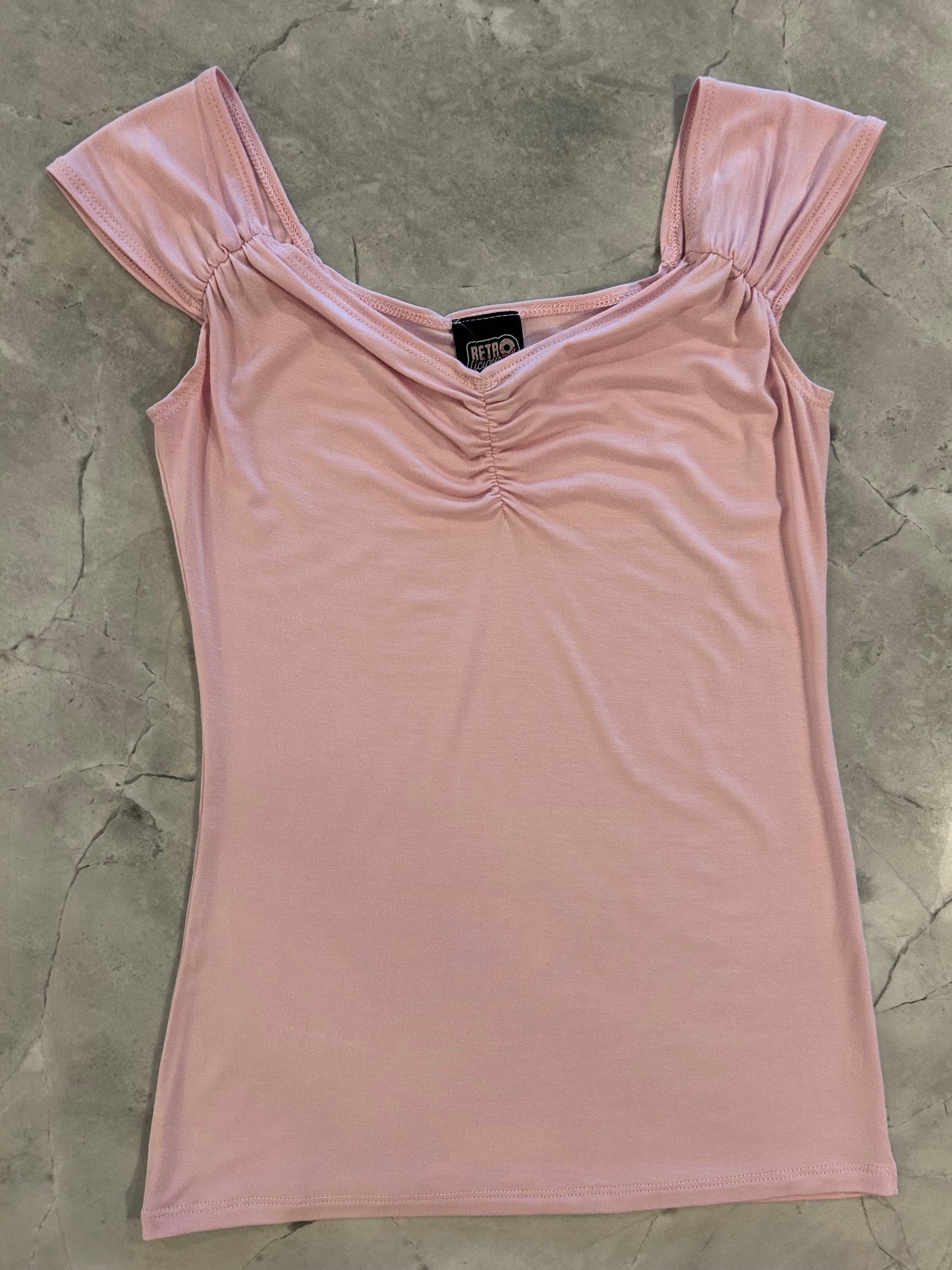 flatlay of blush isabel top