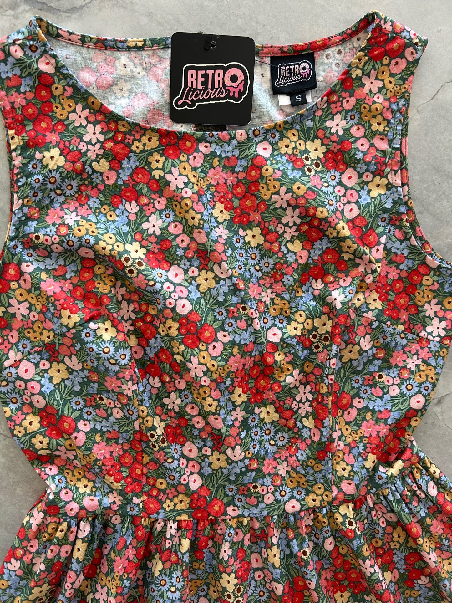 flatlay of the bodice of painted floral dress