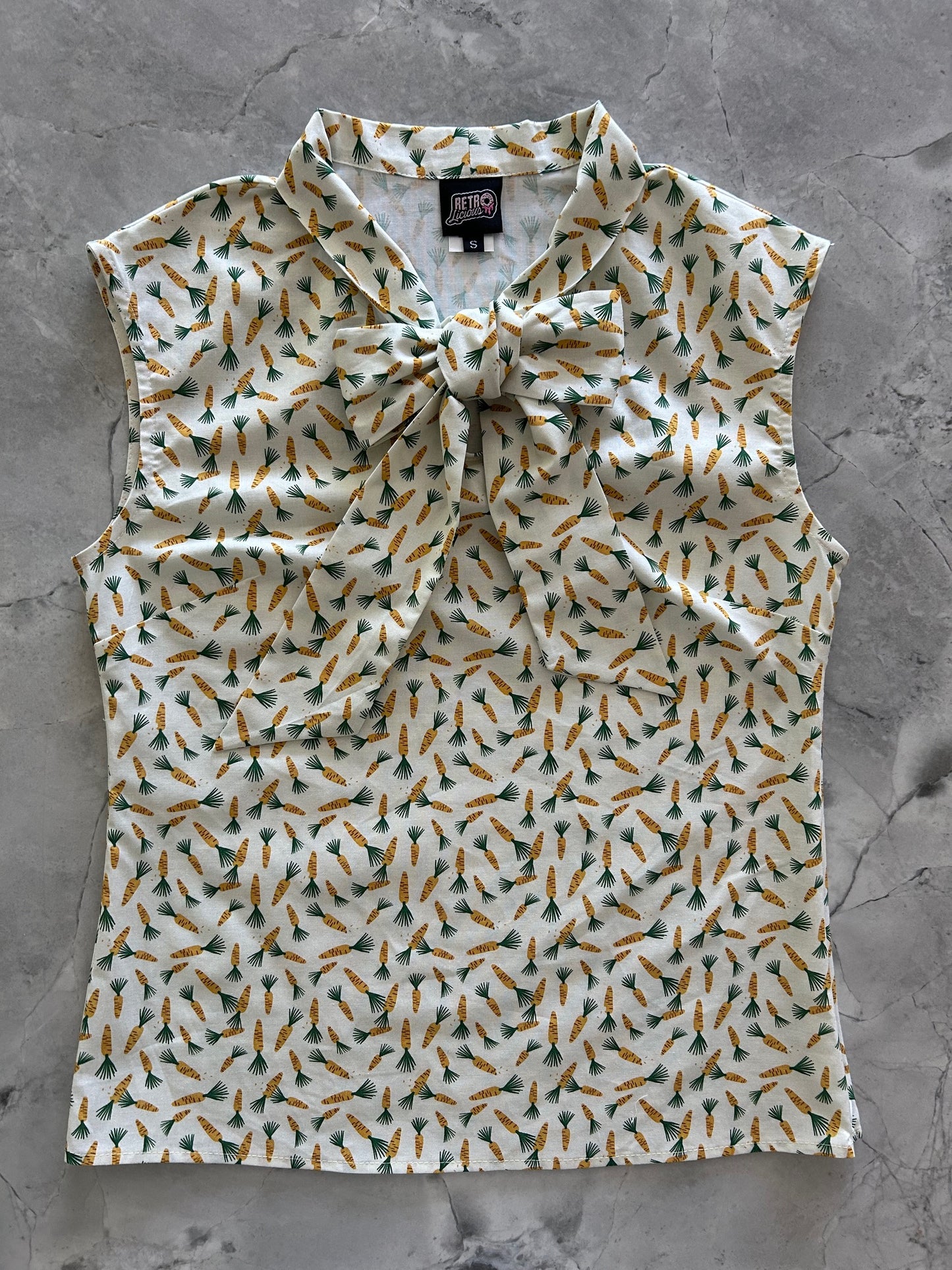 flatlay of carrots bow top