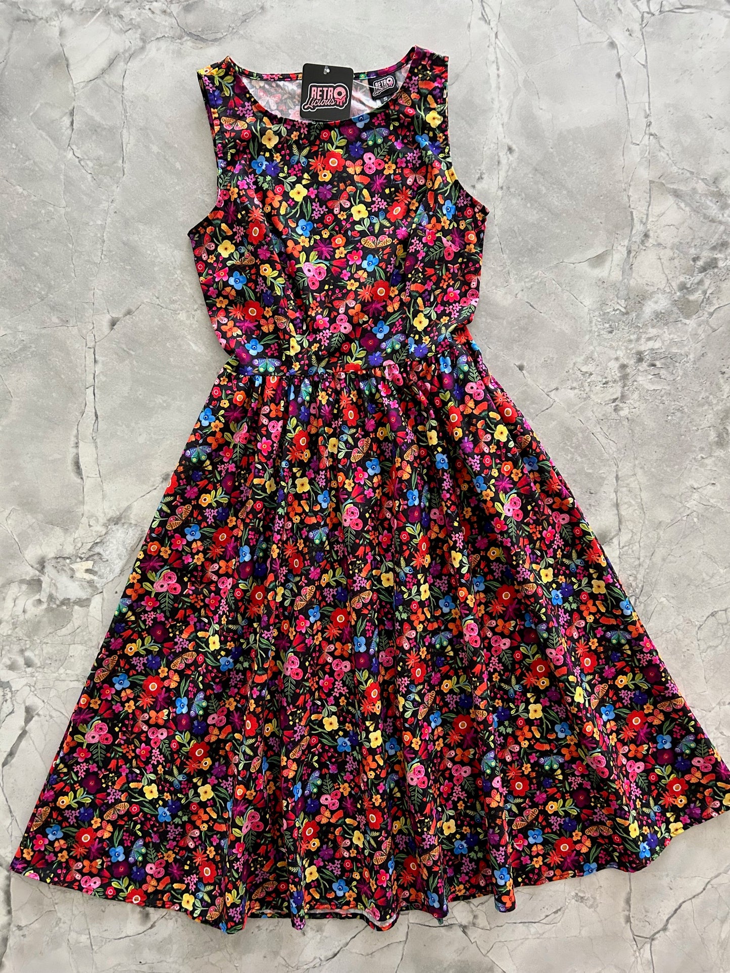 flatlay of butterfly floral midi dress