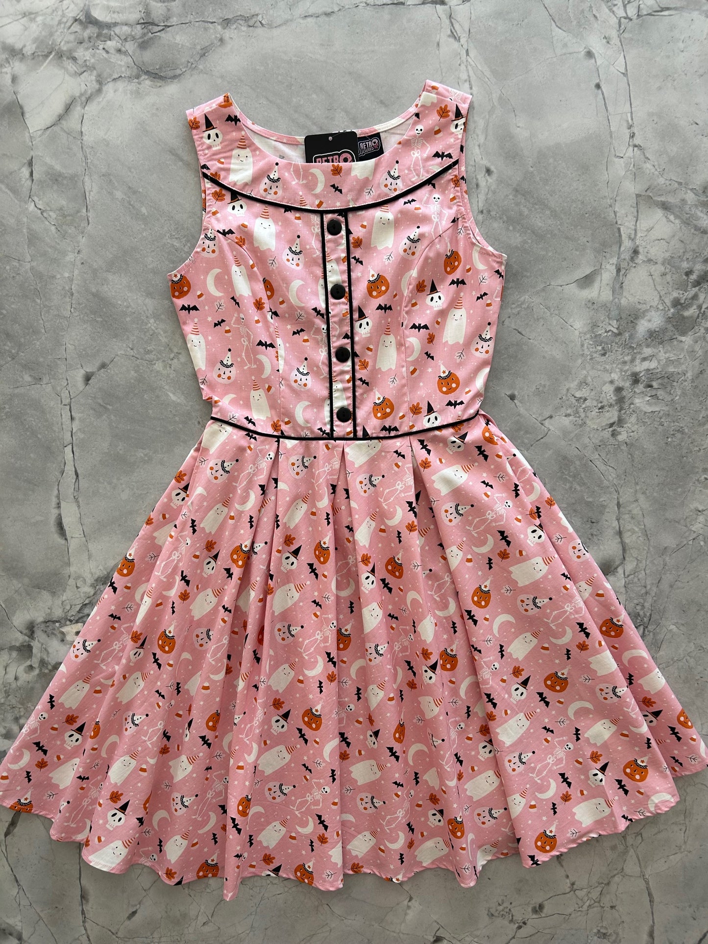 flatlay of elizabeth dress in pink halloween