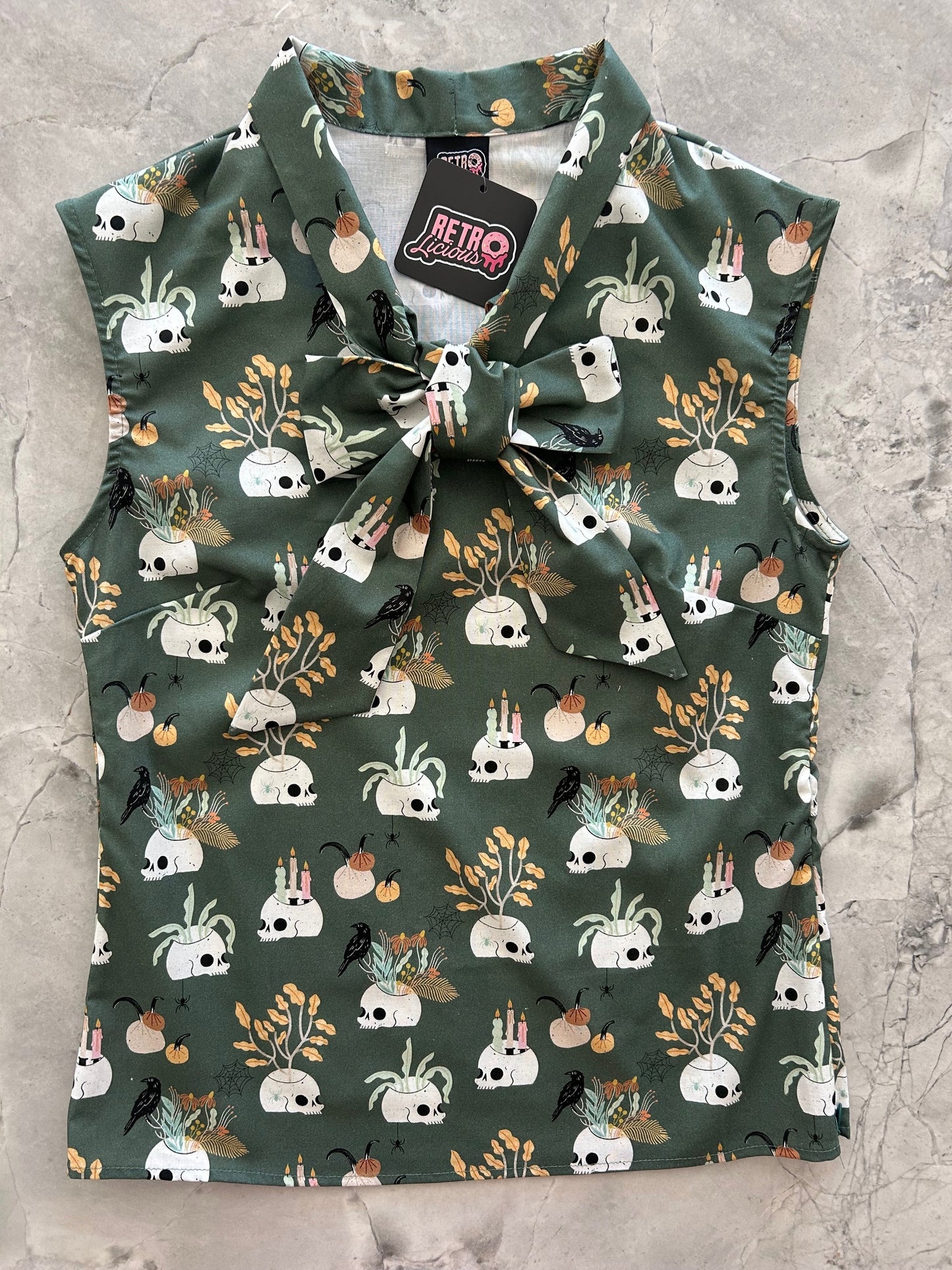 flatlay of Skulls & Candles Bow Top