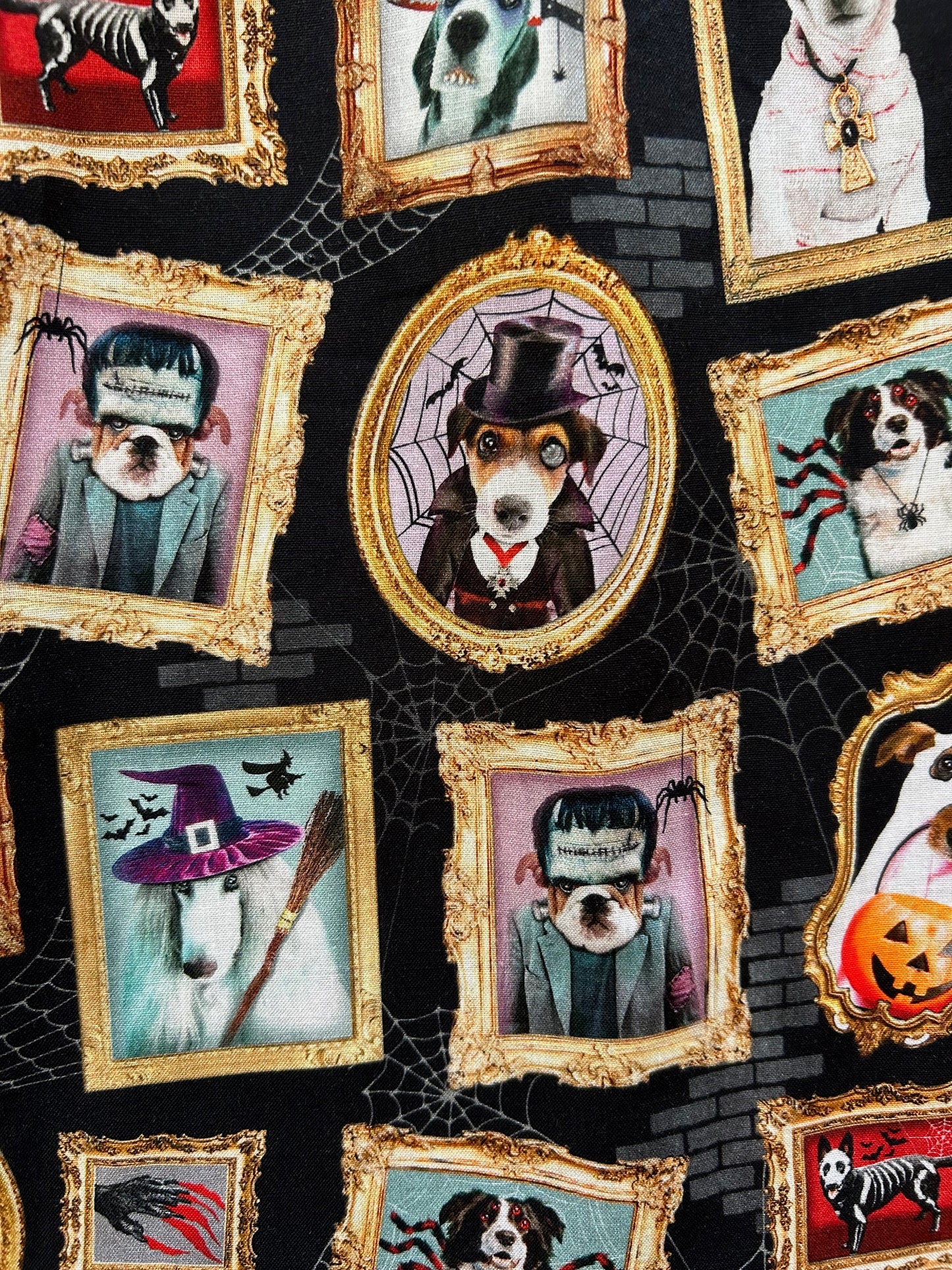 fabric showing the dogs in halloween costumes in frames