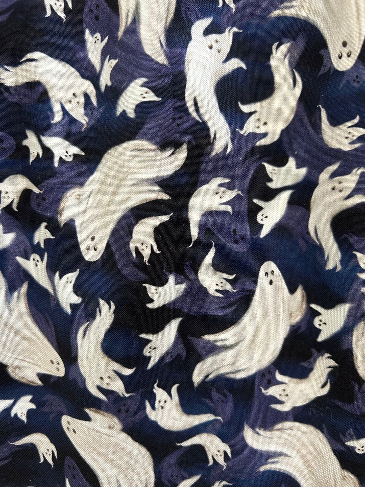 close up of flying ghosts on blue background