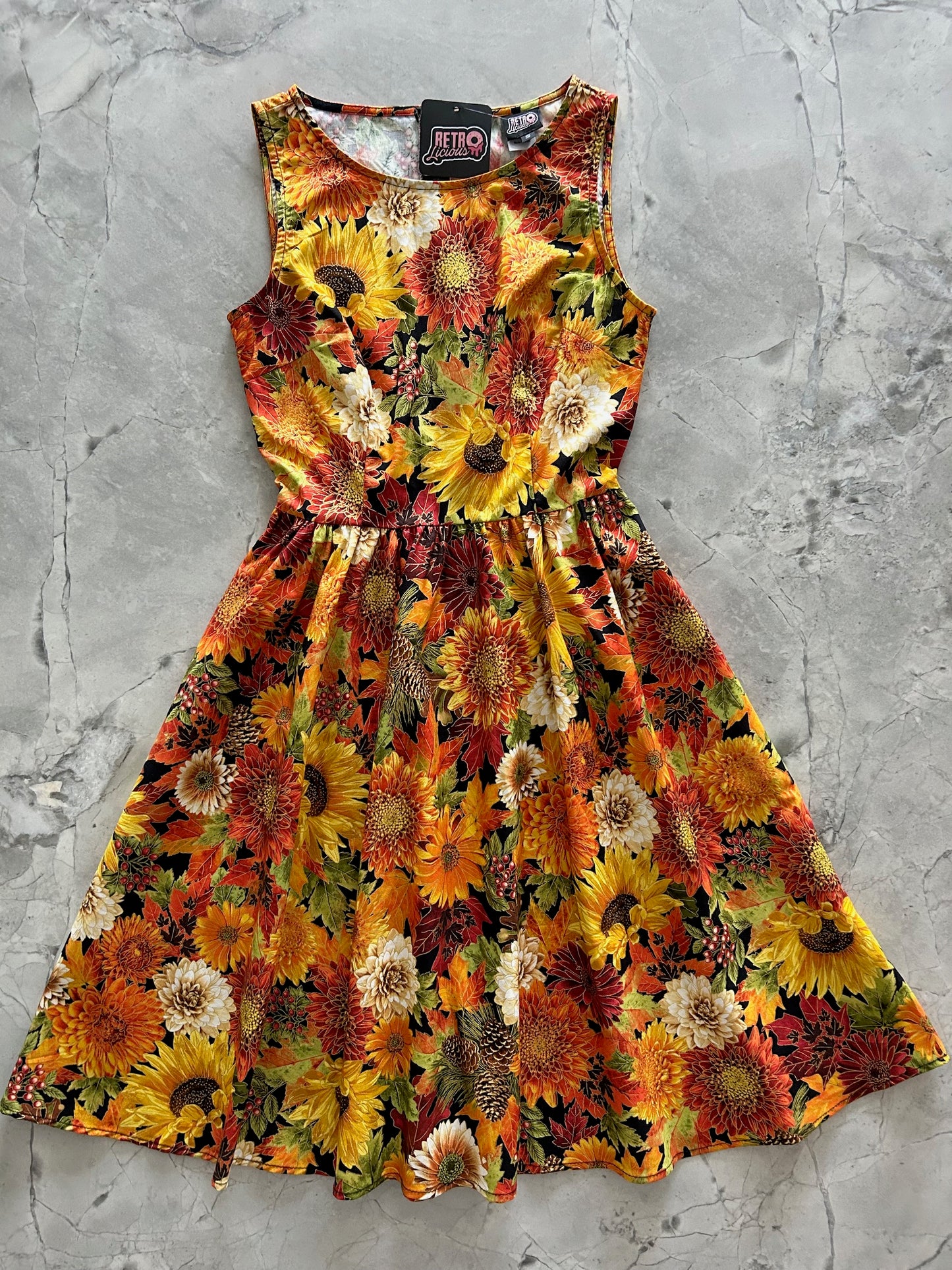 flatlay of our sunflower floral vintage dress showing fall flowers