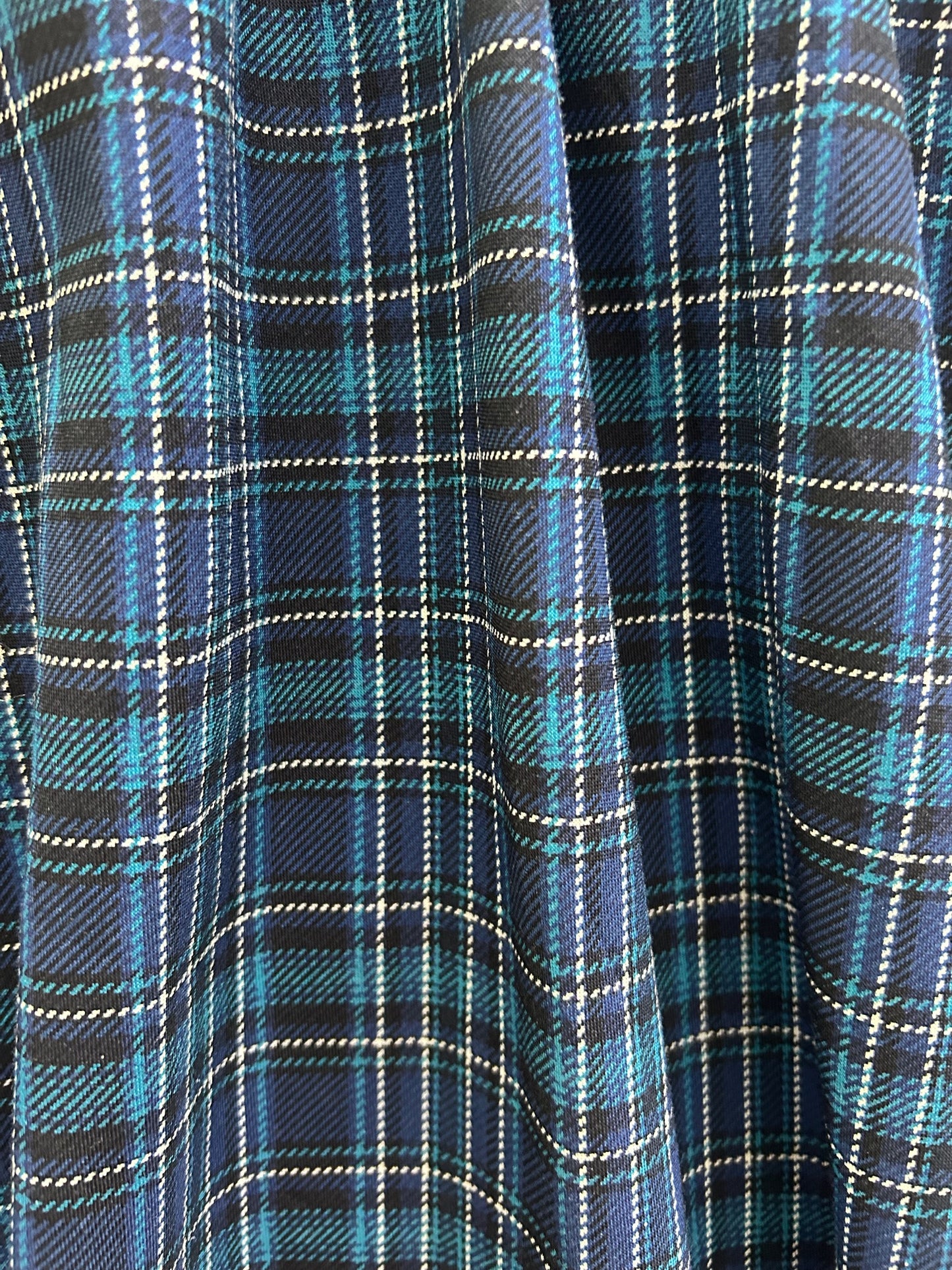 close up of the plaid fabric showing the blue plaid pattern