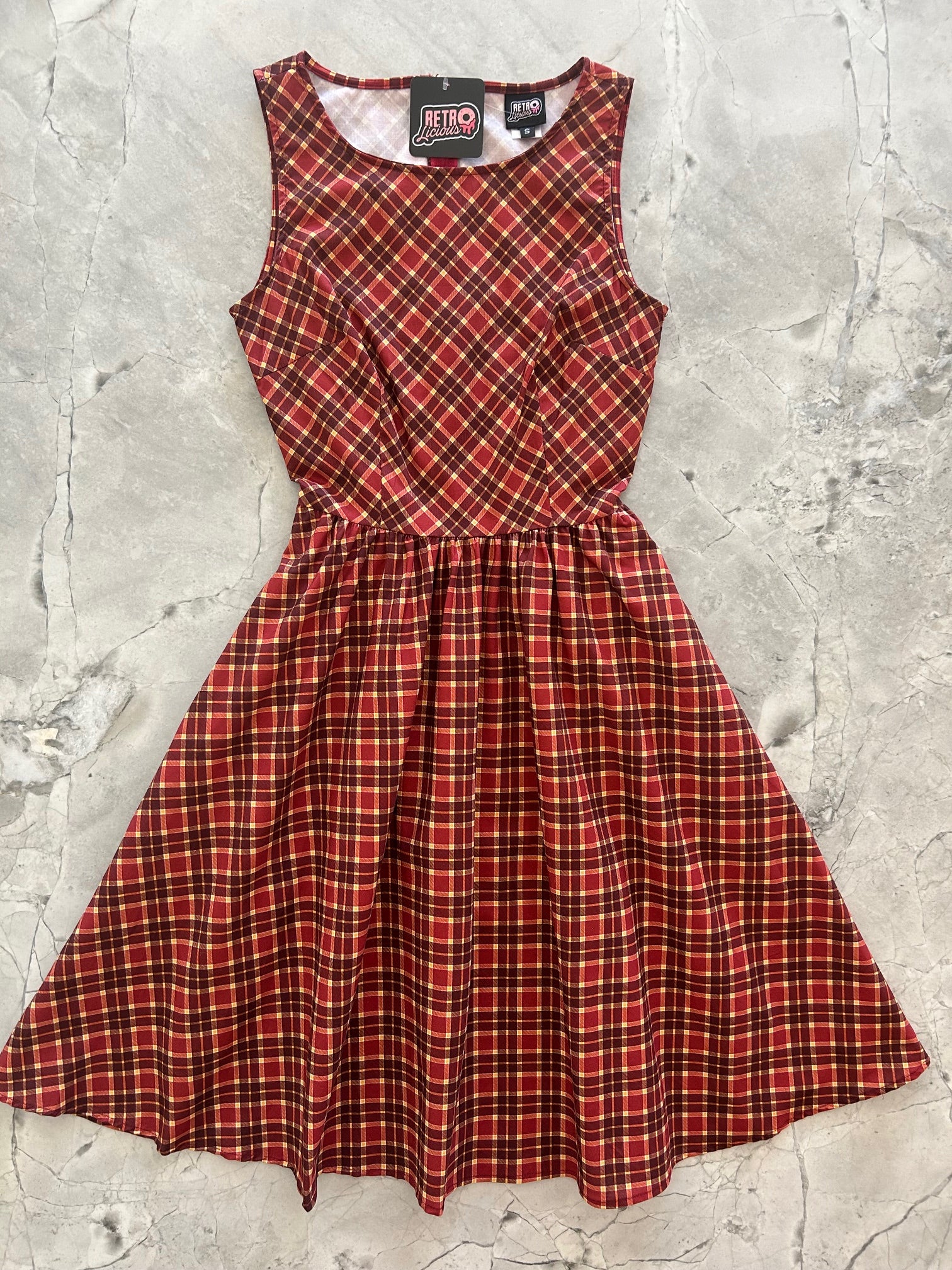 flatlay of plaid vintage dress