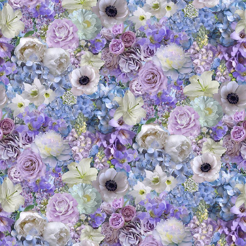 a close up of the vibrant blossoms in lilac, blue and white