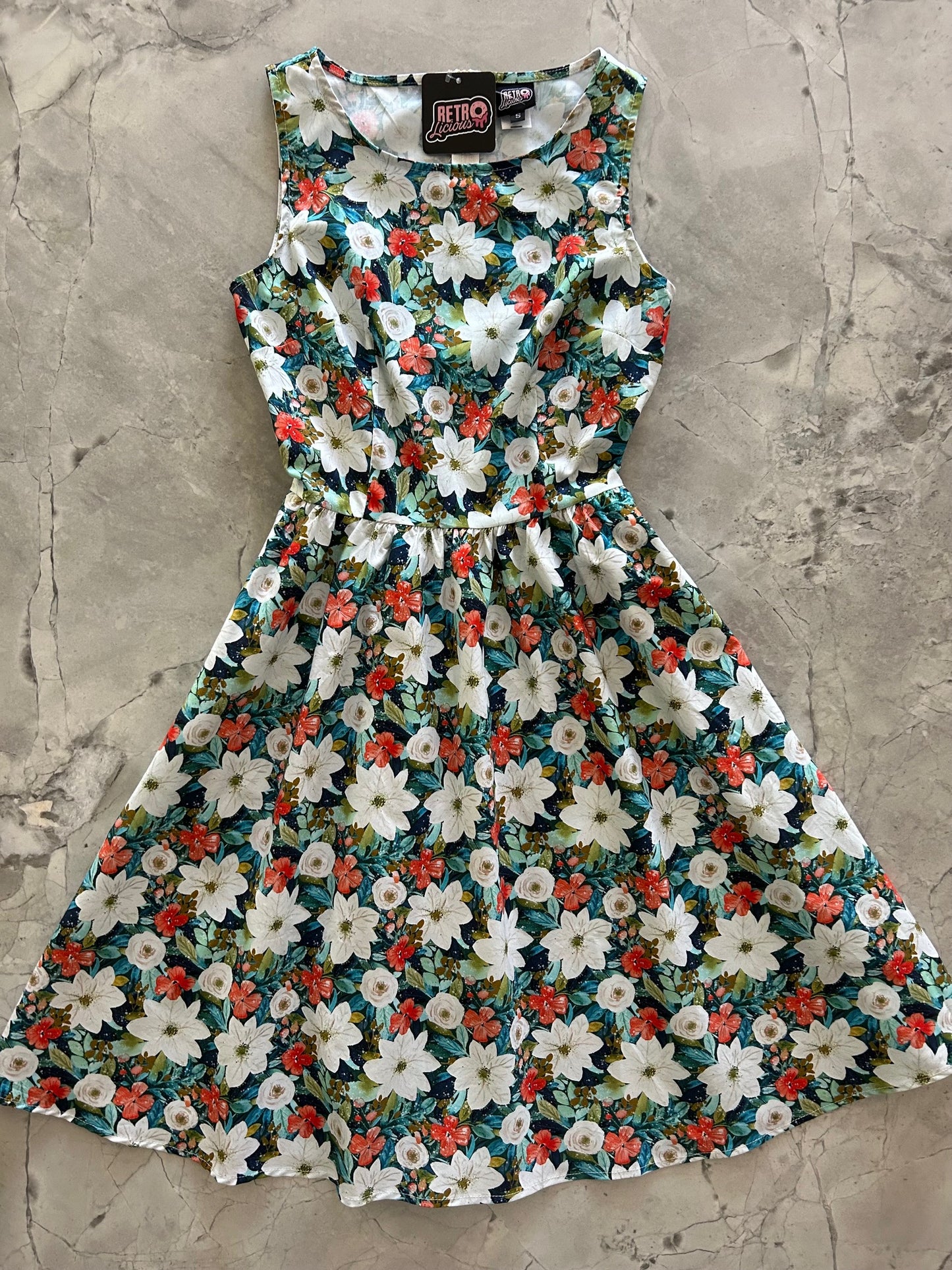 flatlay of winter floral vintage dress