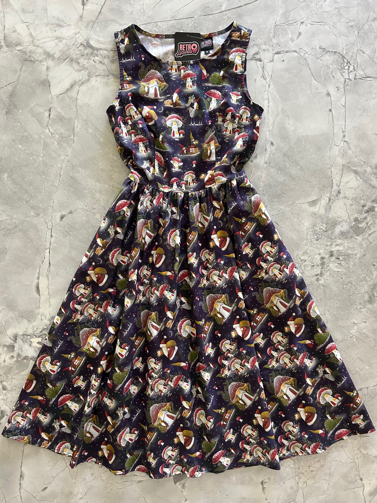 flatlay of gnomes midi dress