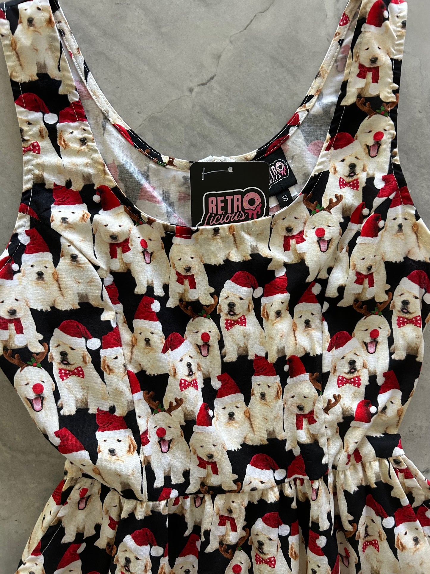 bodice of dogs in santa hats on black background