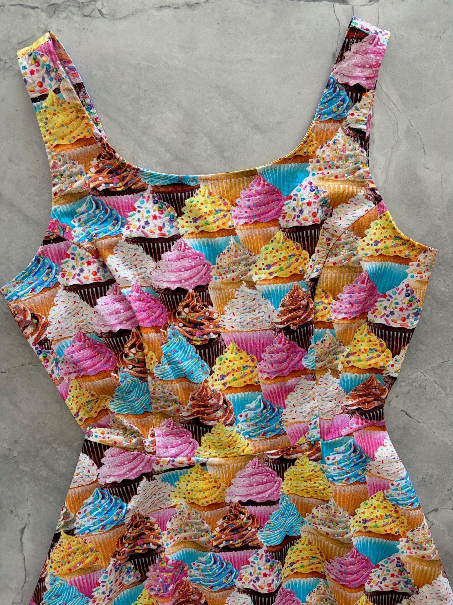 Colorful patterned dress on a gray surface