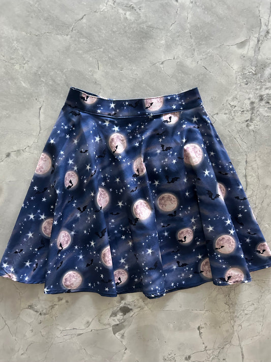 flatlay of bat moon skater skirt
