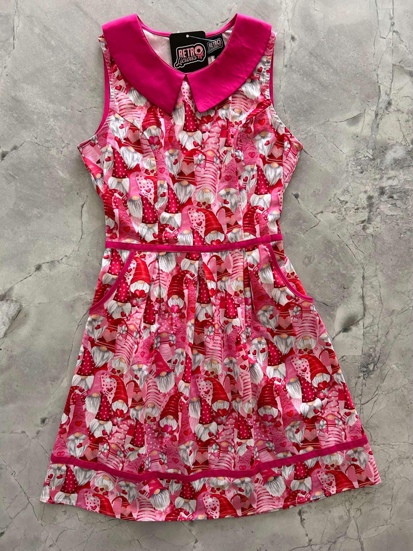 a flat lay of gnomes collared dress