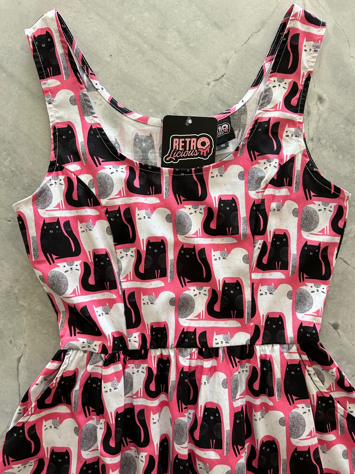 a close up of the bodice of the cats fit and flare dress