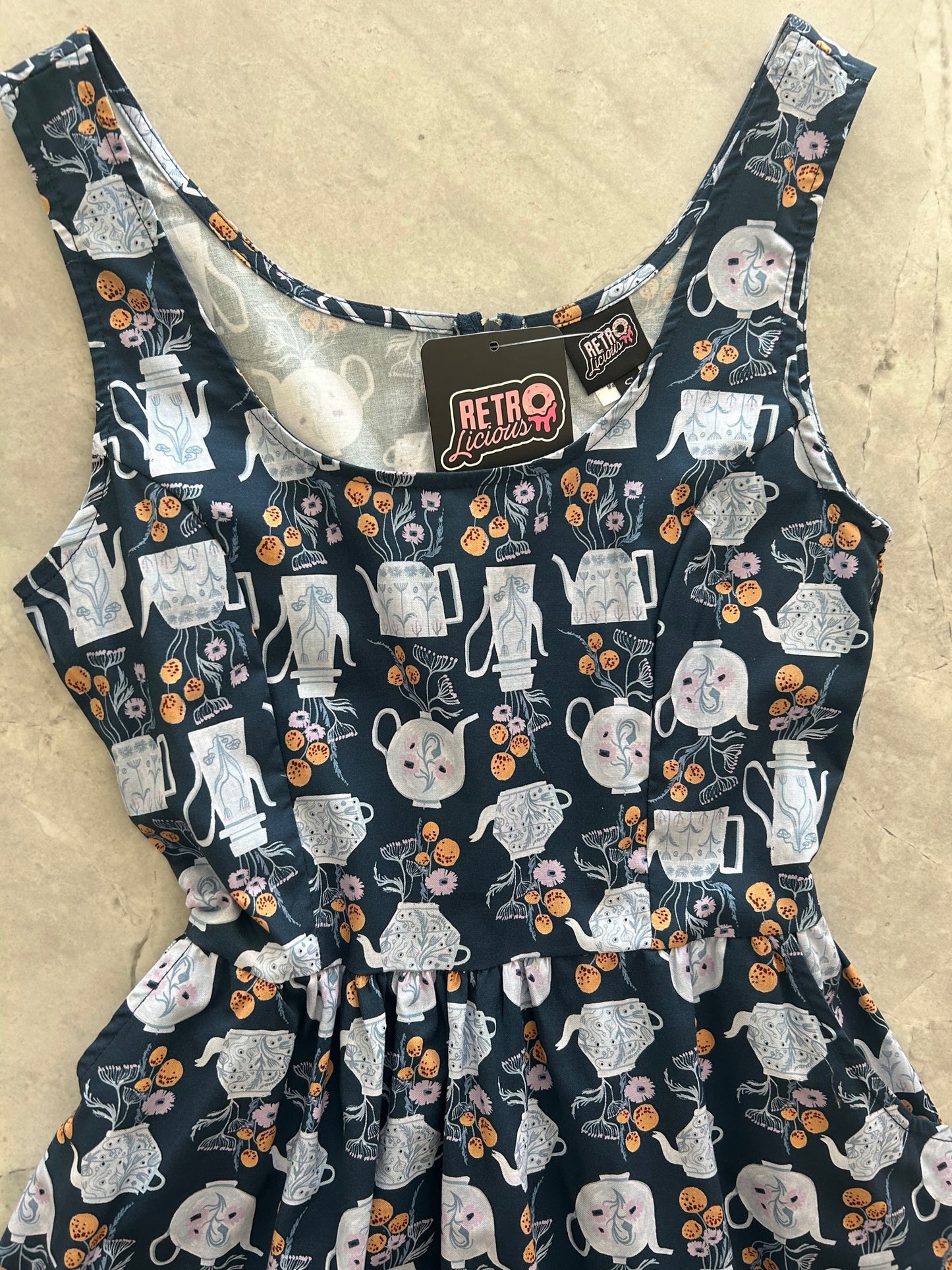 a close up of the bodice of the teapots fit and flare dress