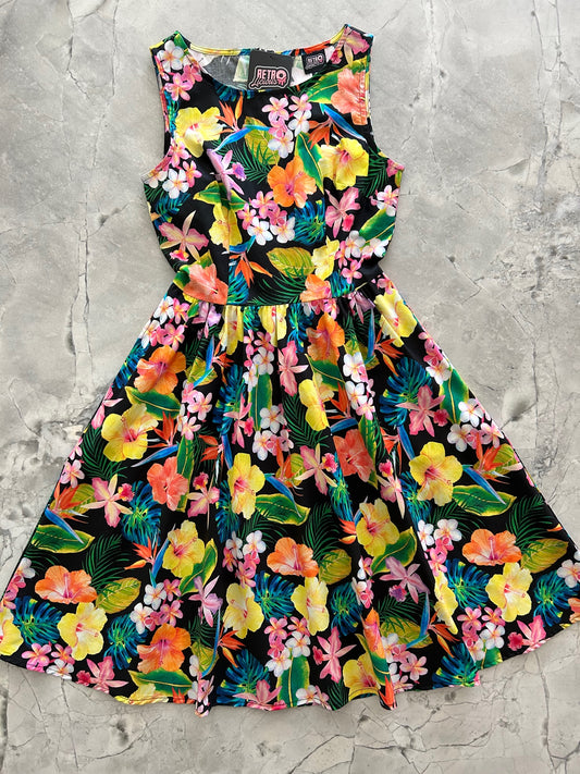 a flat lay of the front of the tropical vintage dress
