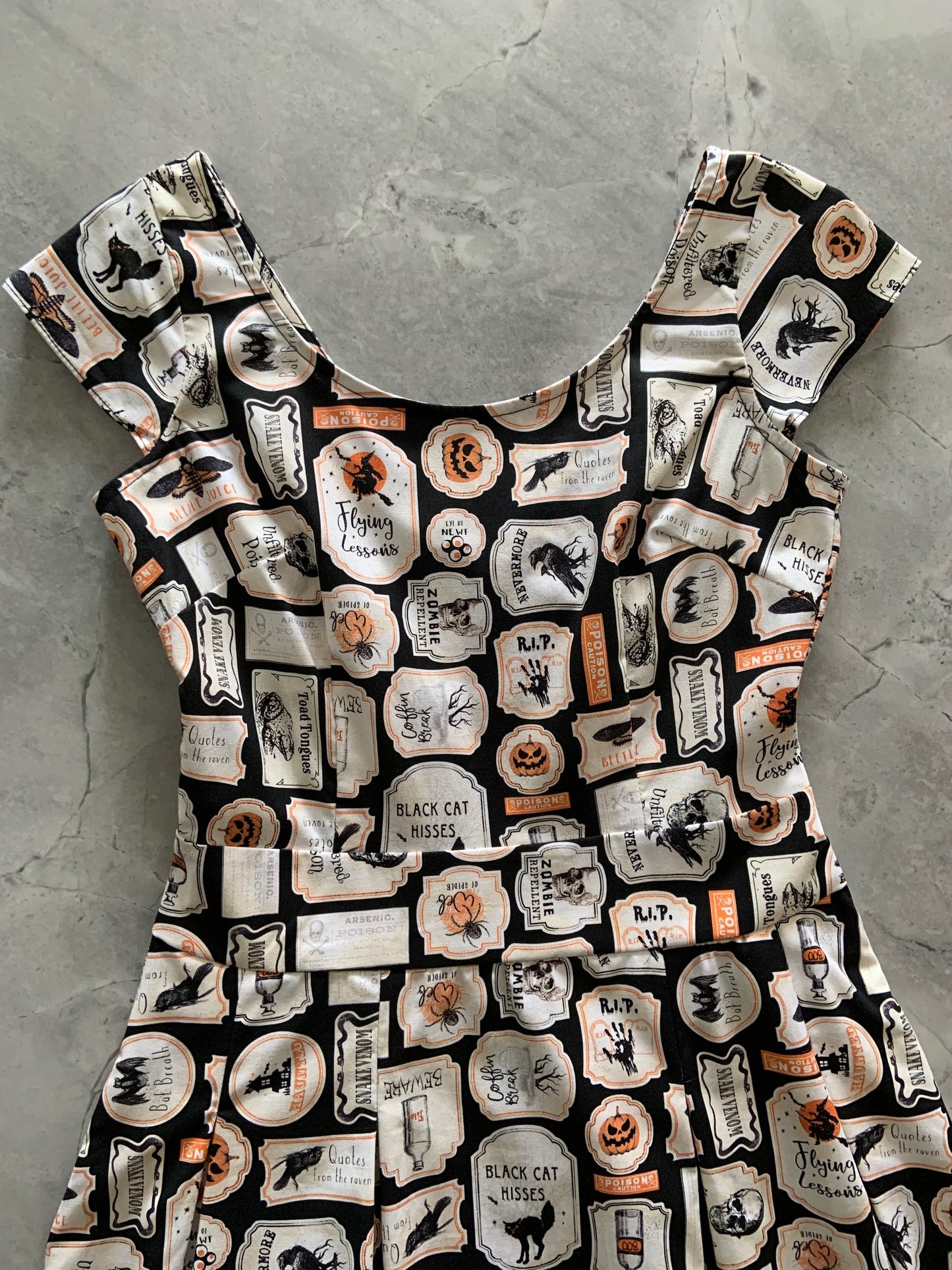 a close up of the bodice of the margaret dress in halloween print