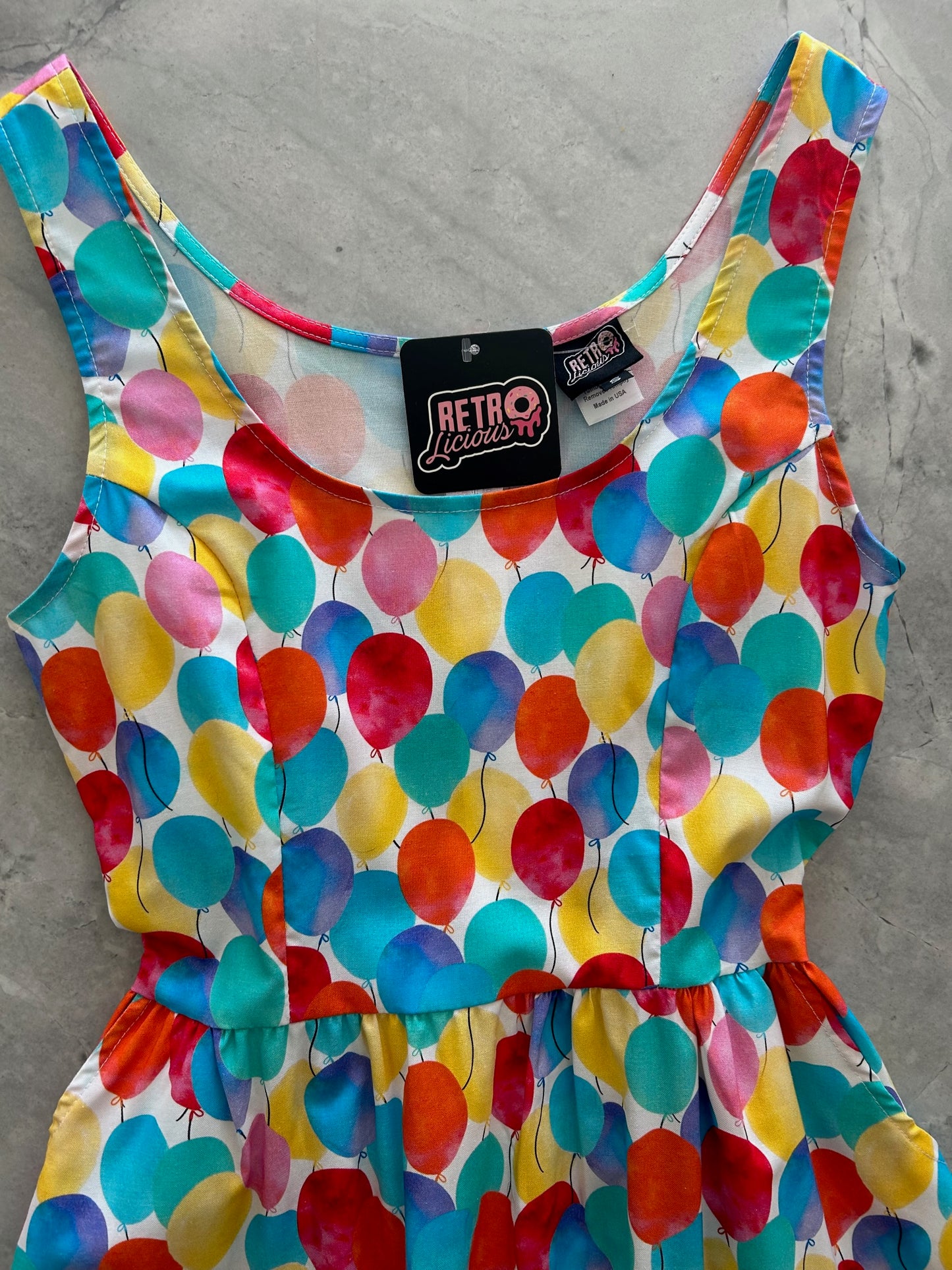 a close up of the bodice of the front of the balloons fit & flare dress