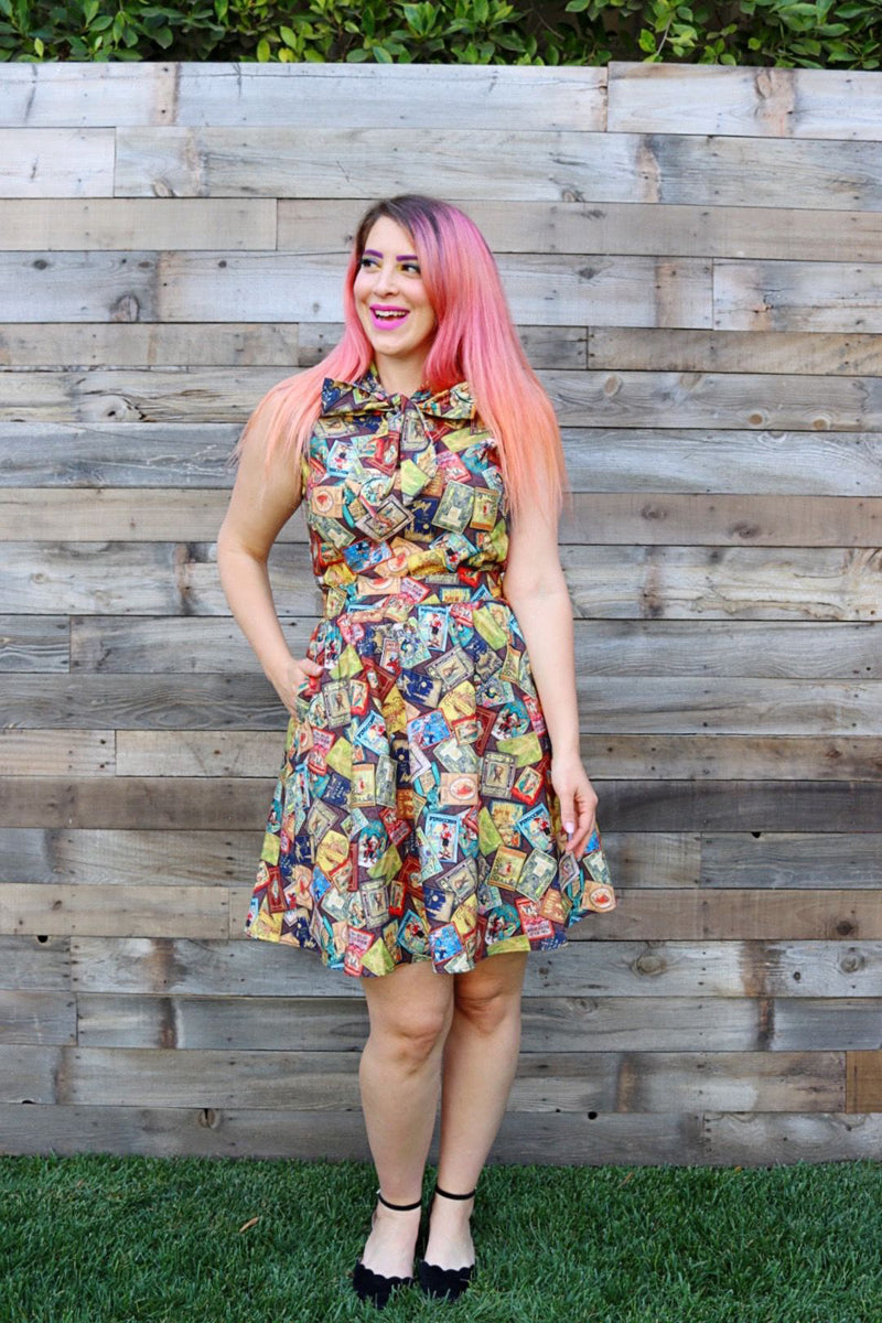 full length of model standing in front of a wood wall wearing our fairytale books bow top