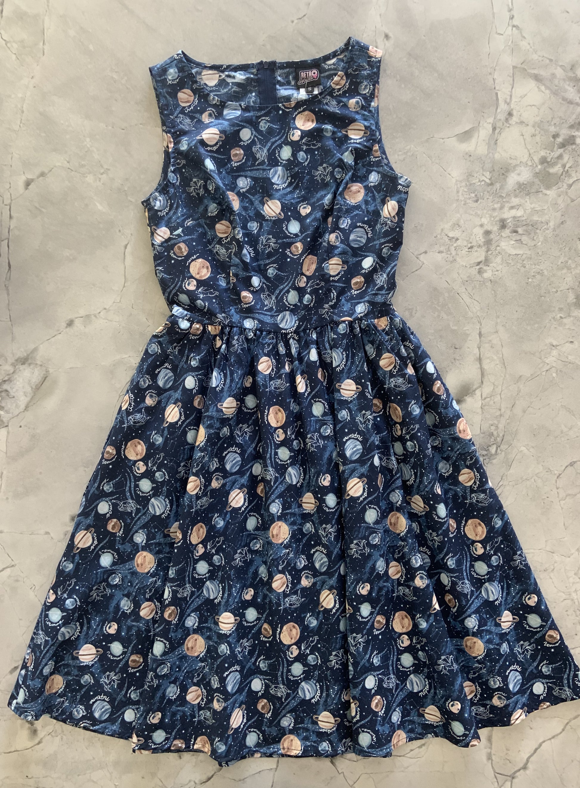 a flat lay of the front of the planets vintage dress