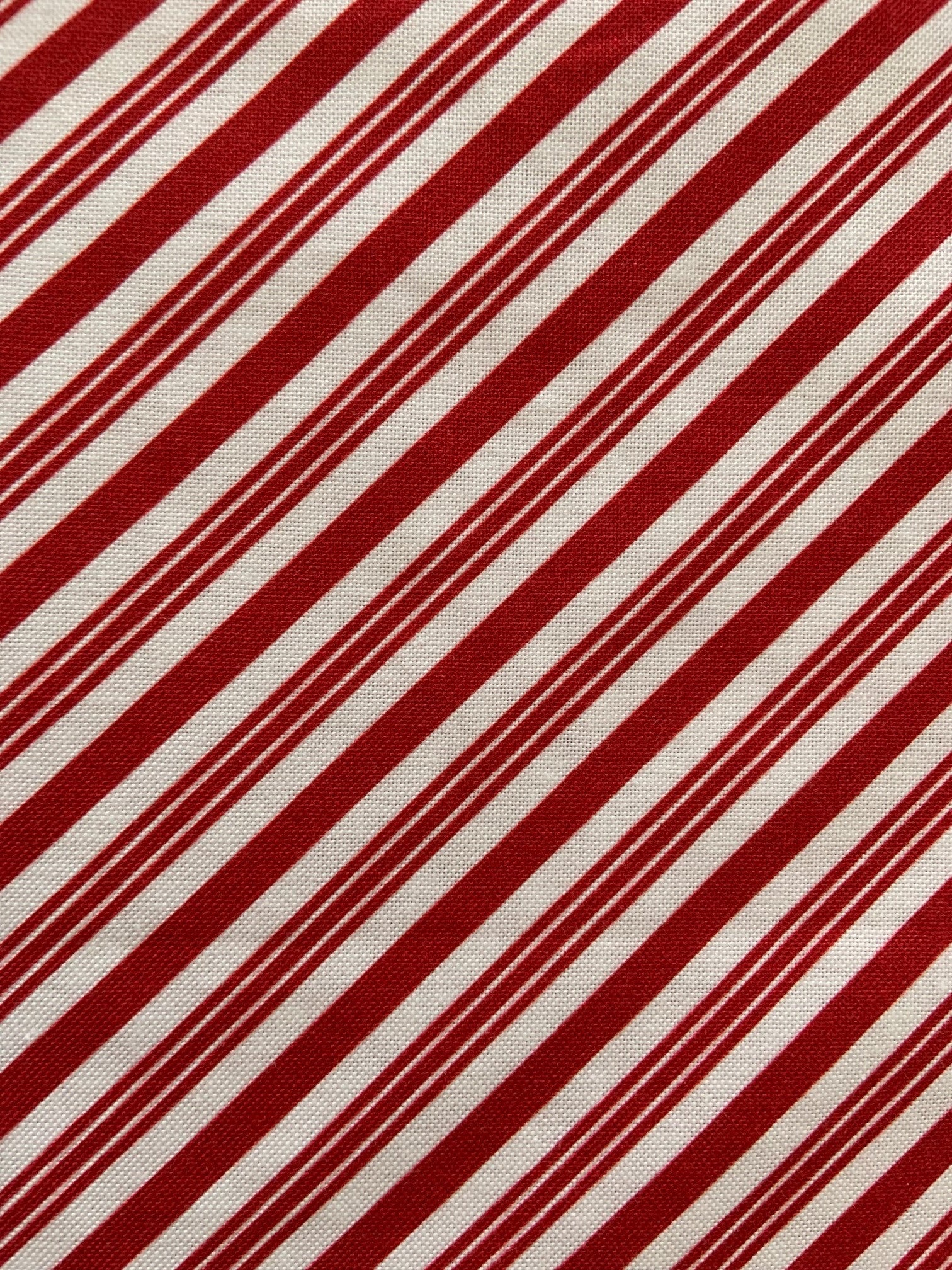 a close up of the fabric for our candy cane stripe bow top