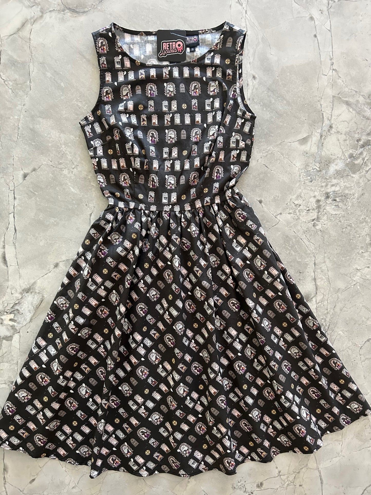 a flat lay image of the front of the Sale School vintage dress