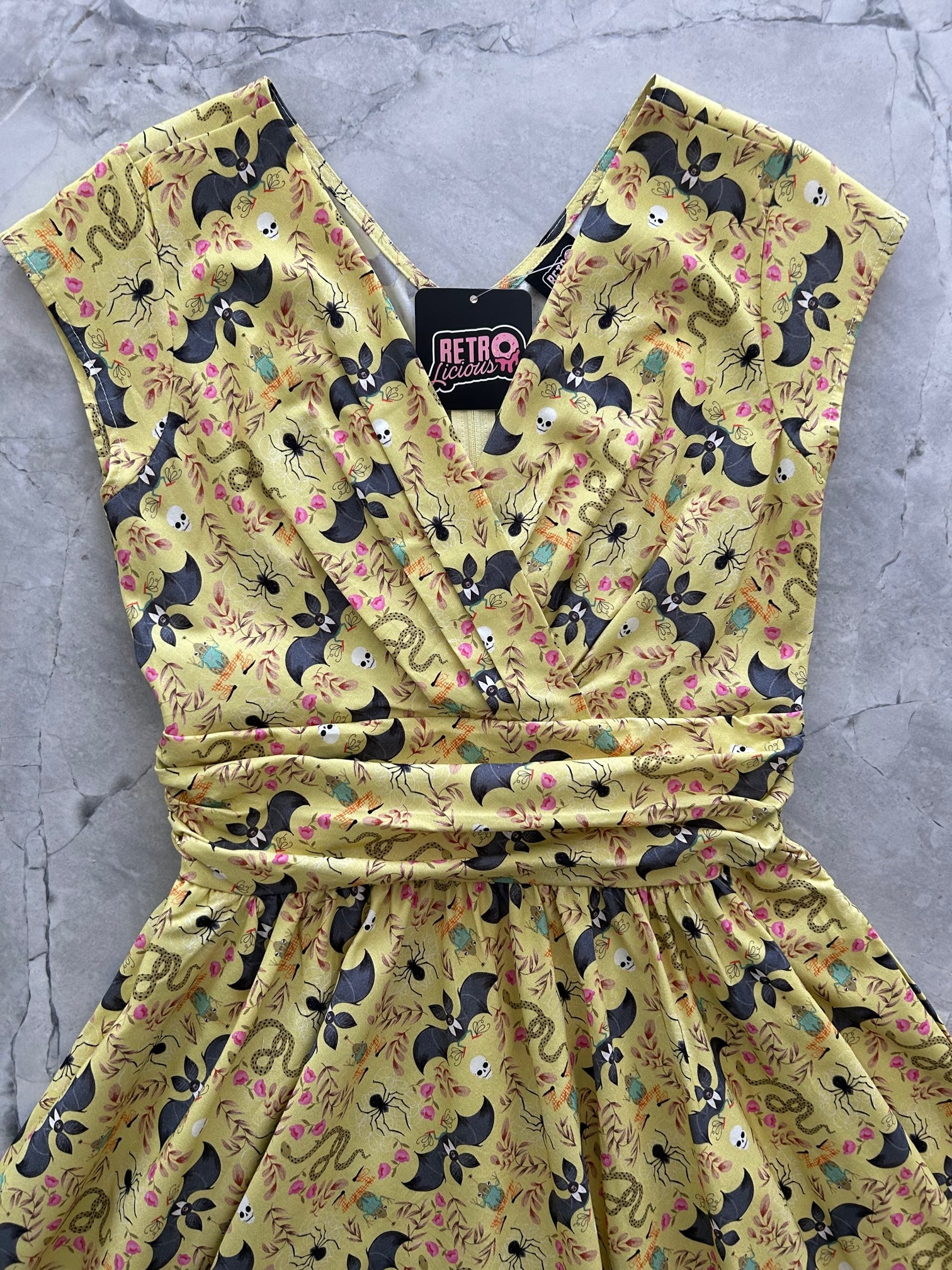 a close up of the bodice of our frogs and bats greta dress