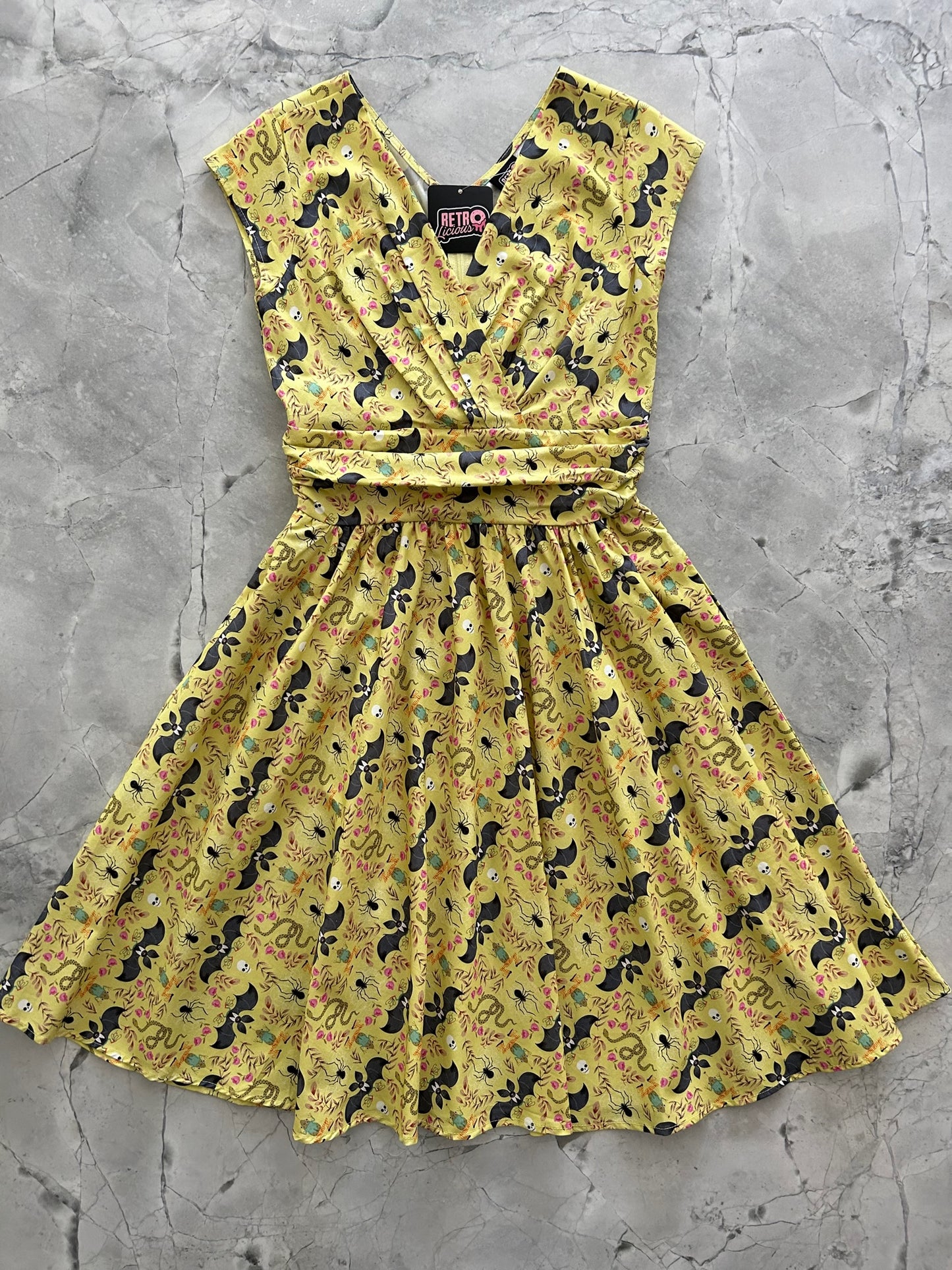 a flat lay of the front of the Frogs and bats greta dress