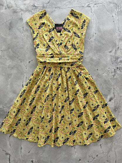 a flat lay of the front of the Frogs and bats greta dress