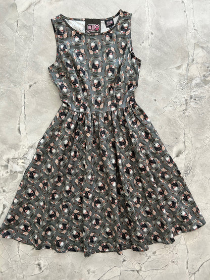 a flat lay image of our Frogs Vintage Dress showing the front of the dress layed out flat