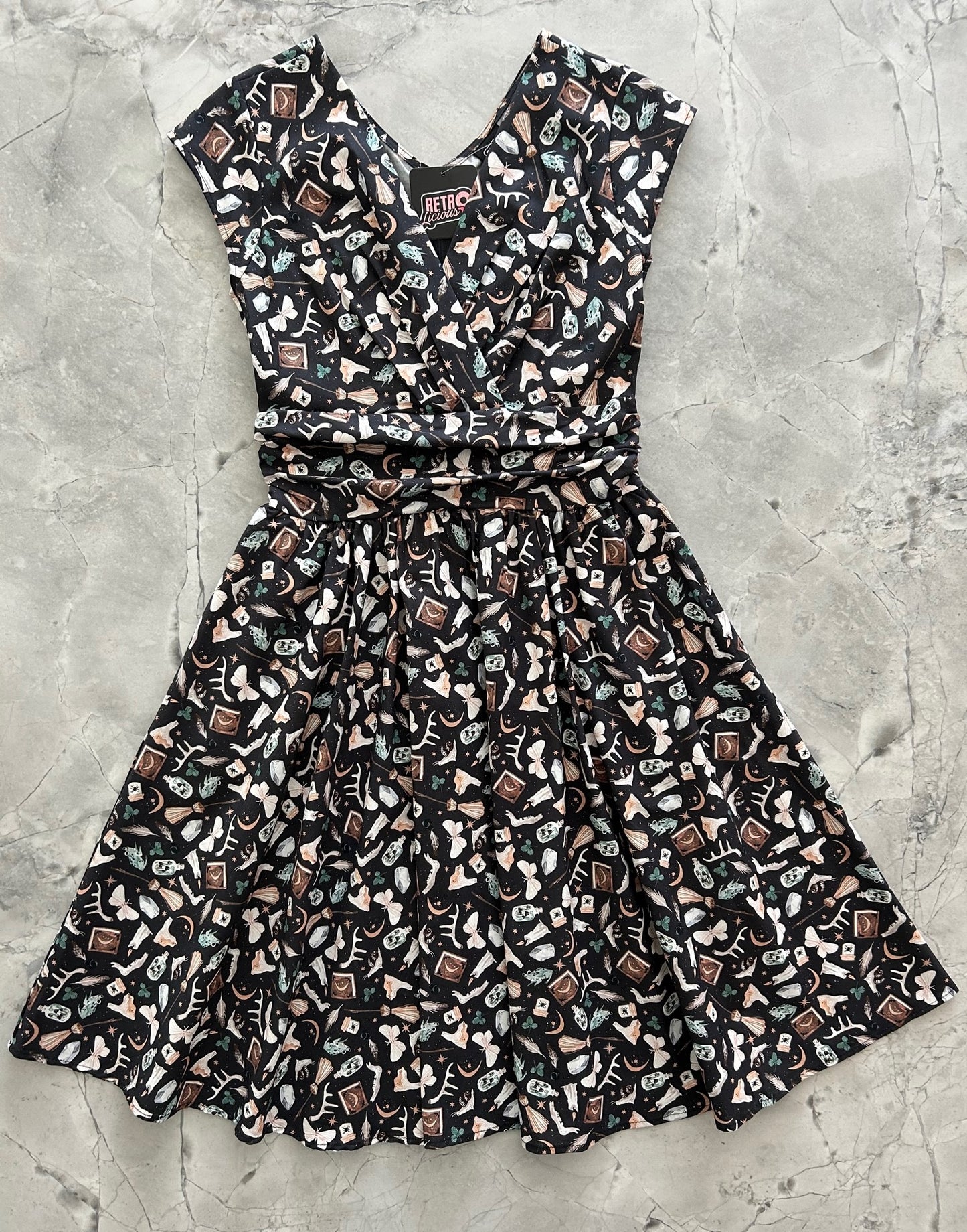 a flat lay image of the front of the Dark Academia Greta Dress