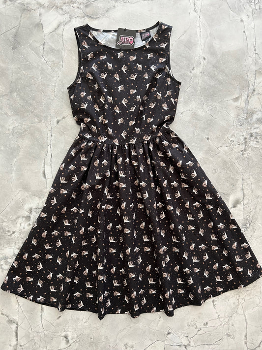 flat lay image of the front of our Gastropod Glamour Vintage Dress showing black dress wtih creme snails and gold stars