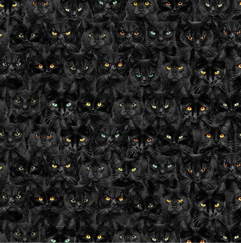 a close up of the fabric print of stacked black cats