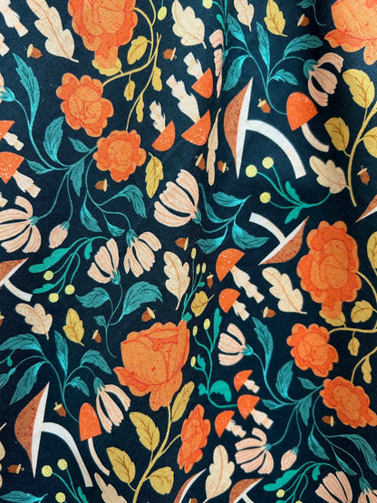 a close up of the print of the Flora Vintage Dress with mushrooms and flowers