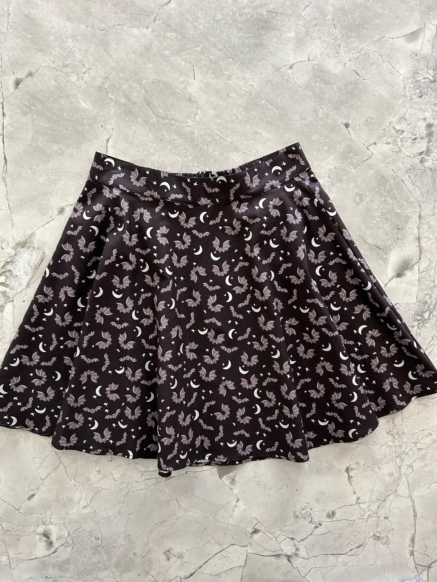 a flat lay of the front of the batty skater skirt