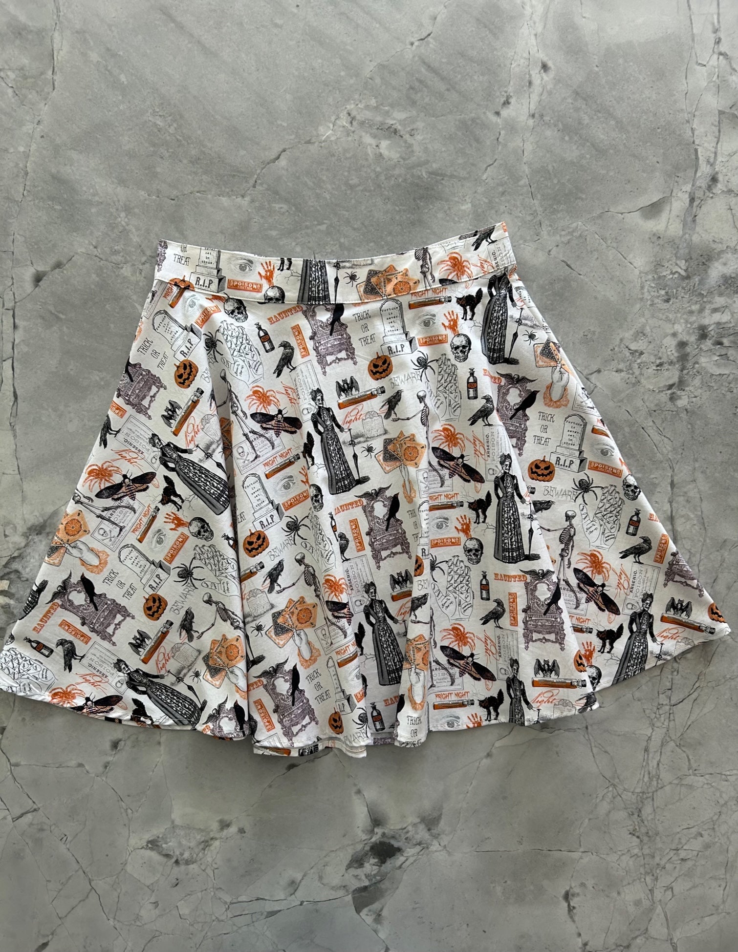 a flat lay of the front of our spooky skater skirt