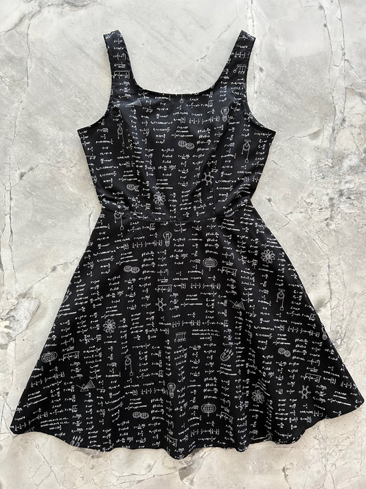 a flat lay image of our equations skater dress showing the entire front of dress layed out flat