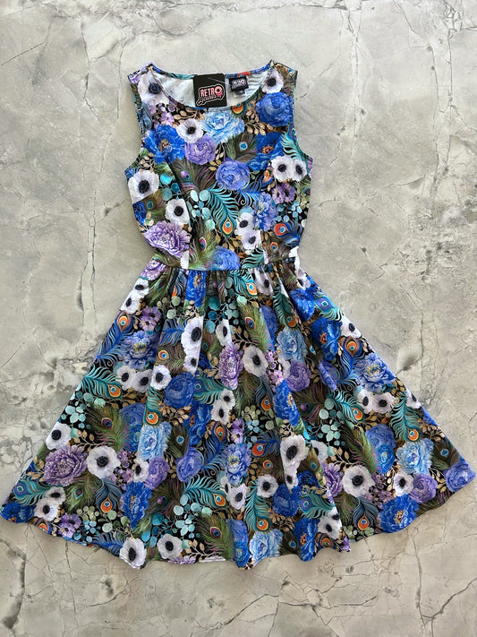 a flat lay of peacock floral vintage dress
