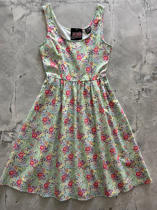 flatlay of floral cats fit and flare dress
