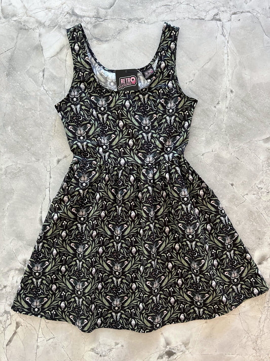 a flat lay of the midnight shorter length fit and flare dress