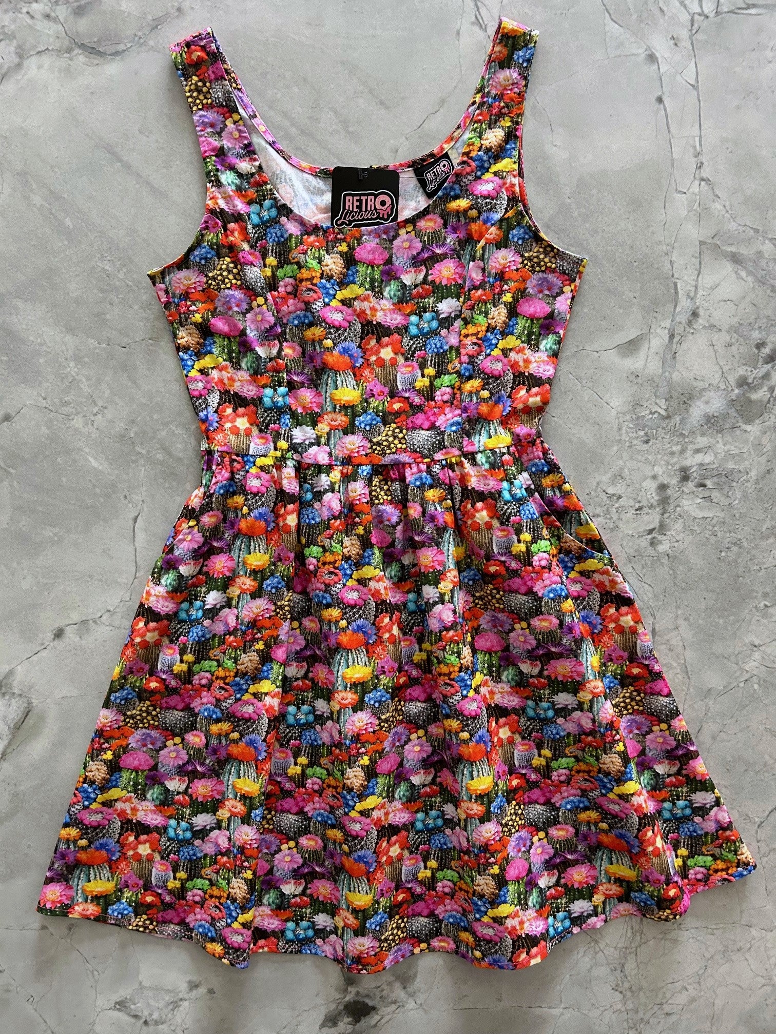 flatlay of front of the desert blooms shorter length dress