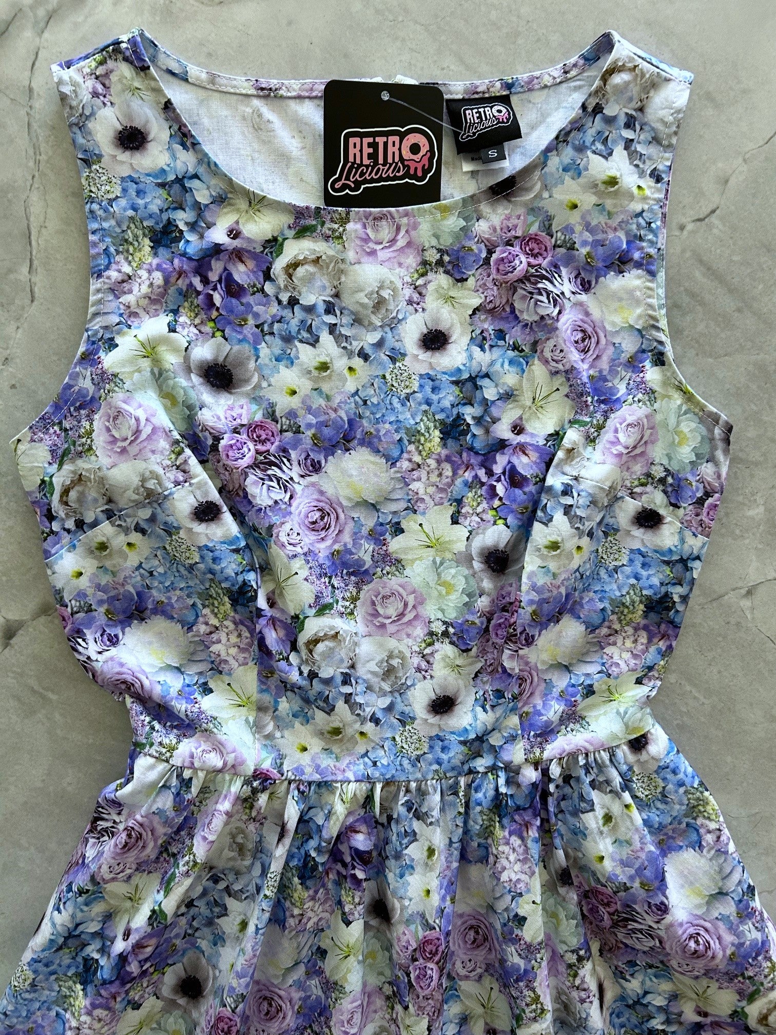 a flat lay of close up of the bodice of the blossom dress